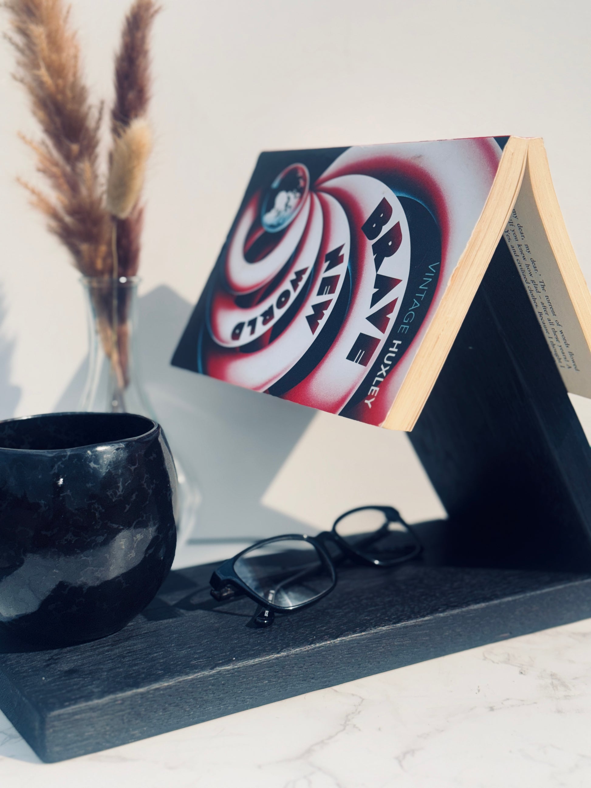 Main image of book rest holding a book, glasses and mug