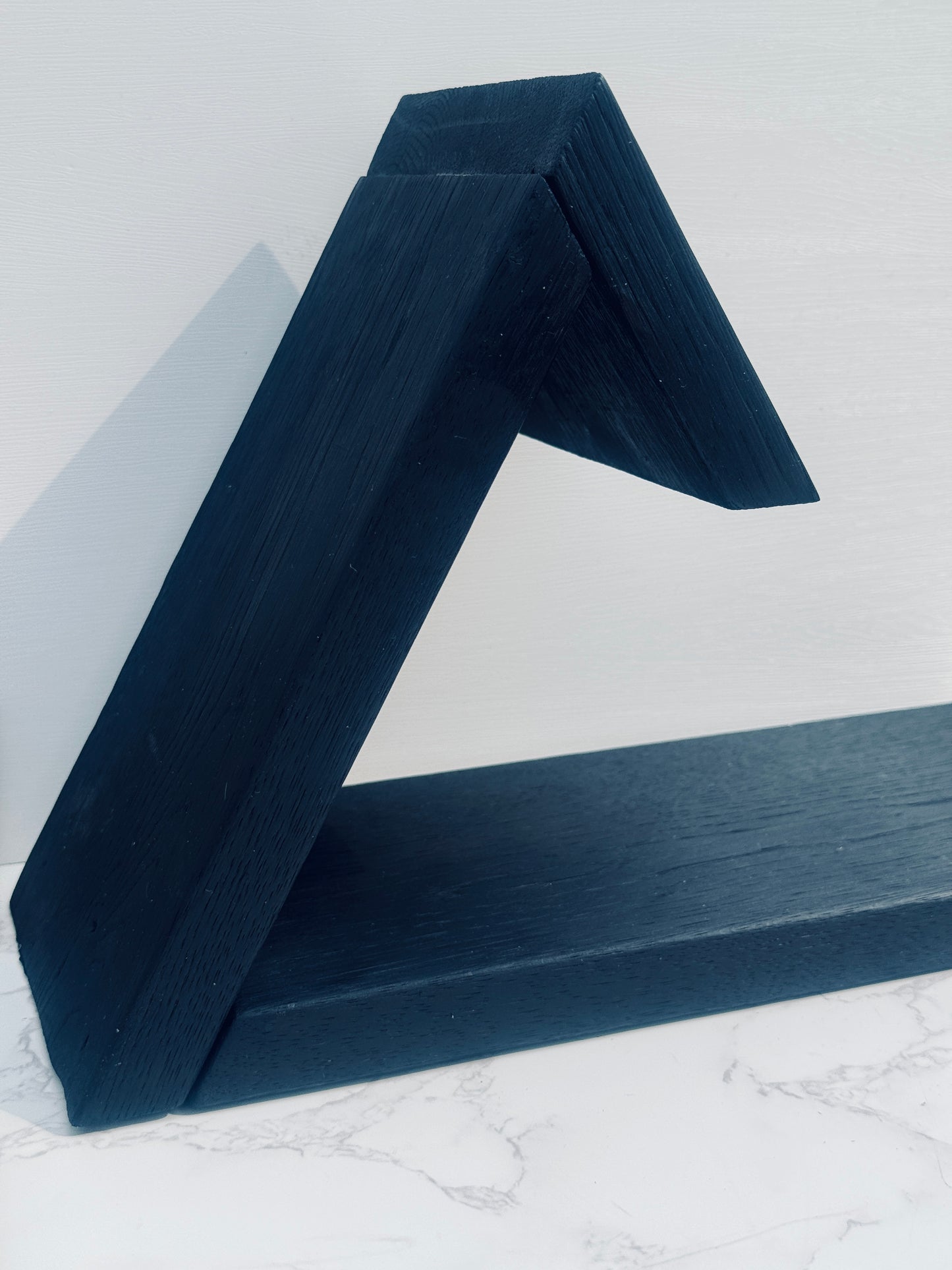 Side view of book rest showing joinery and triangular angles