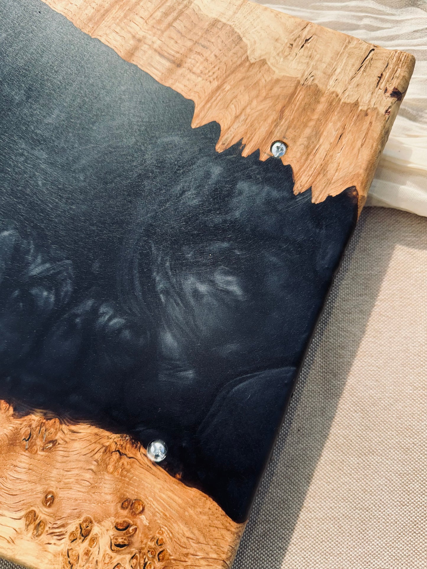 Oak burr and black onyx epoxy serving tray underside hardware image of inset screws which allow the tray to sit flat 