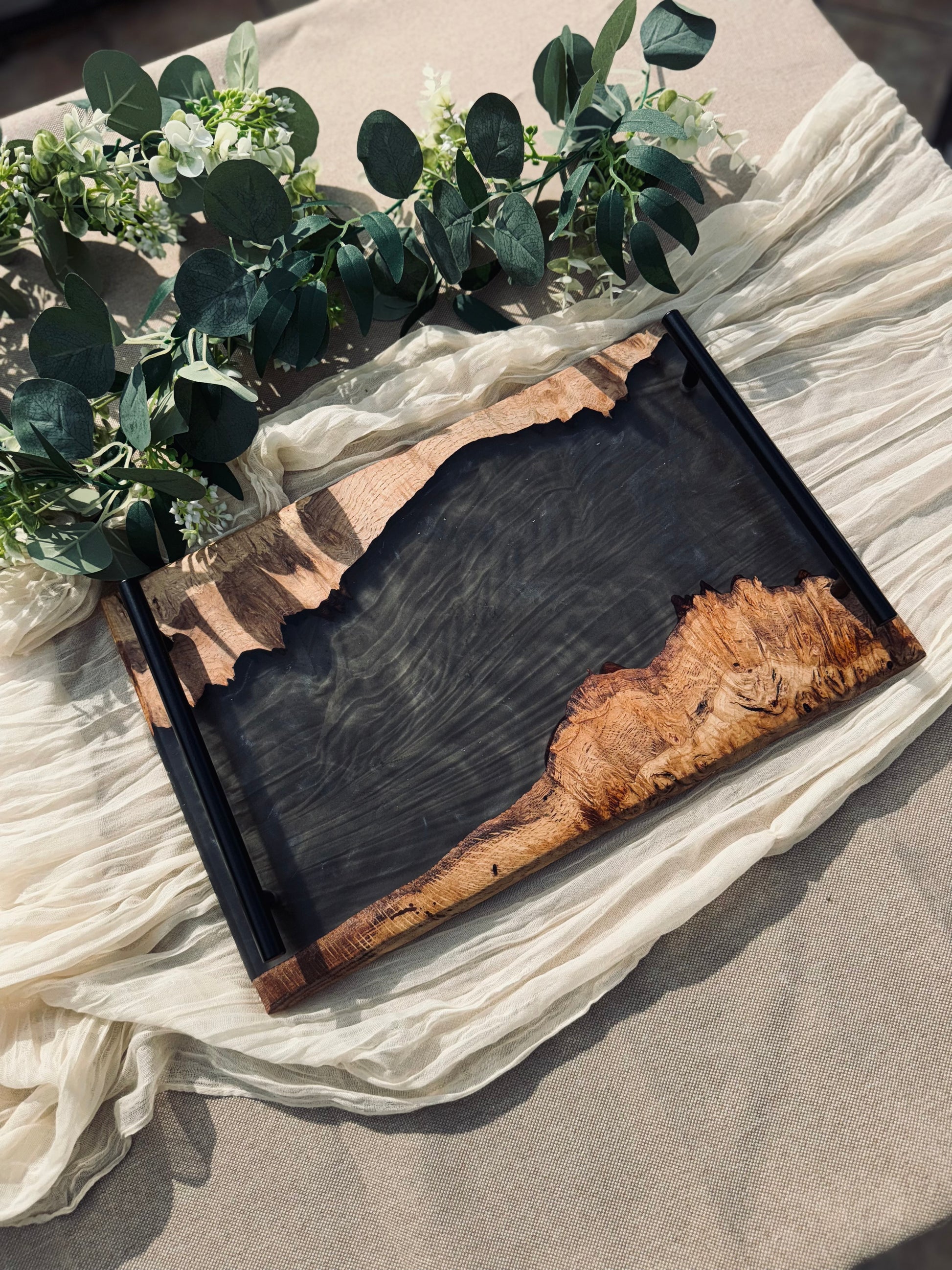 Oak and Smokey Epoxy Serving Tray image taken on a garden table and beige cloth